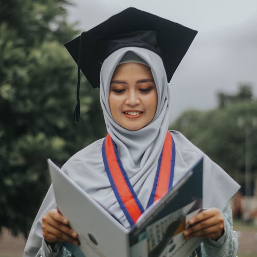 student with degree in hand